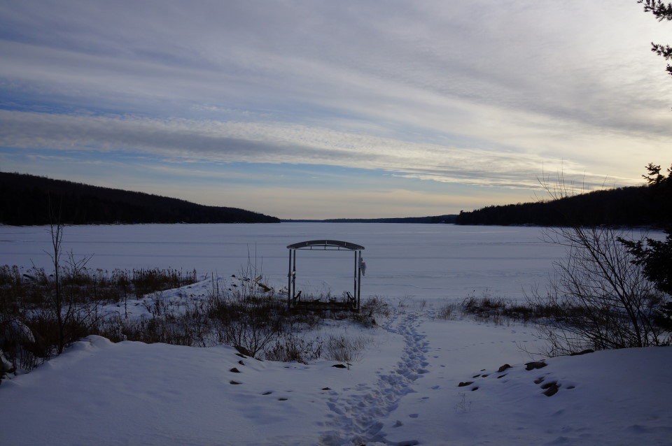 The week started like past weeks.  A bit of damp cold in the air, snow on the lake and inches of ice under that lake snow.