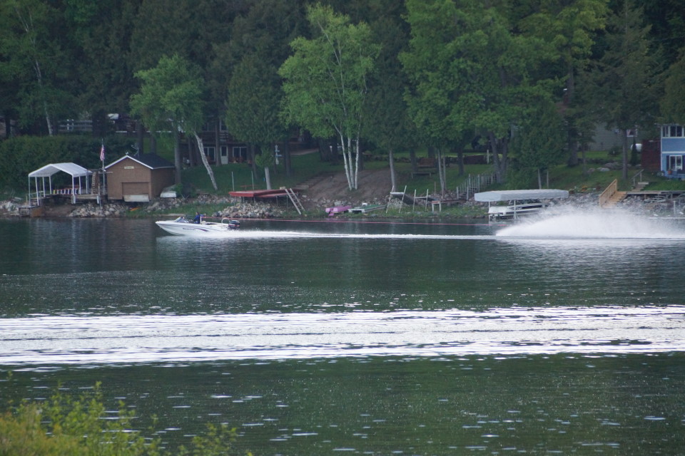 The lake is cold.  The temperature of the water on the north end varies from 59°F to 63°F depending on the wind.  Some have still managed to introduce ski/kneeboard/wakeboard/barefoot to lake.  Most of them were wearing wet/dry suits and all of them were cold.