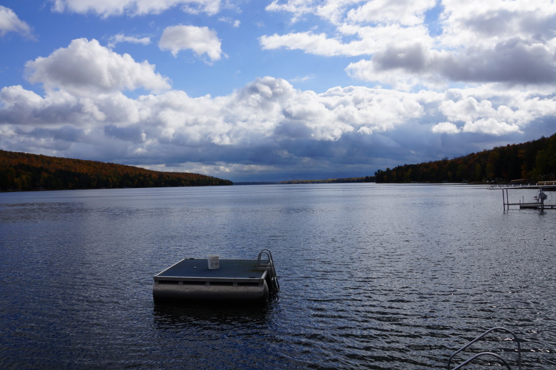 Wind and rain, well mostly rain, raised the lake level and grounded the drone this week. It looks like there will be several opportunities next week to get above the trees to view the post-peakness of the northwoods. We'll be there. One place we won't be is in the lake without a wet or dry suit, 59°F is 3°F below our minimum swimmable water temperature. A colder lake is a negative aspect of Fall. A positive Fall feature is a dramatic lowering of the bug population, or more specifically the mosquito population. The dark clouds of biting bugs that, just a few weeks ago, thundered over the hills and hollows are mostly extinct. The few bugs that are left, combined with thicker clothing, have made pest based exsanguination uncommon. Other positive Fall facets include snow not sticking, lake tubers remaining in remission, declining lawn mowing frequency, and hats.<br><br><br>-Nemo still keeps his mosquito club close.