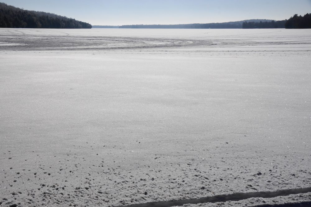 The snow covering the ground is only about 3 inches deep.  The low levels of the white stuff is keeping many snowmobiles in the garage or trailer.