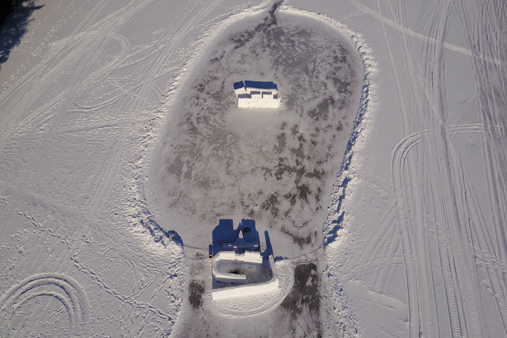 Most of the sticks and detritus have been removed leaving behind only snow walls and scorch marks