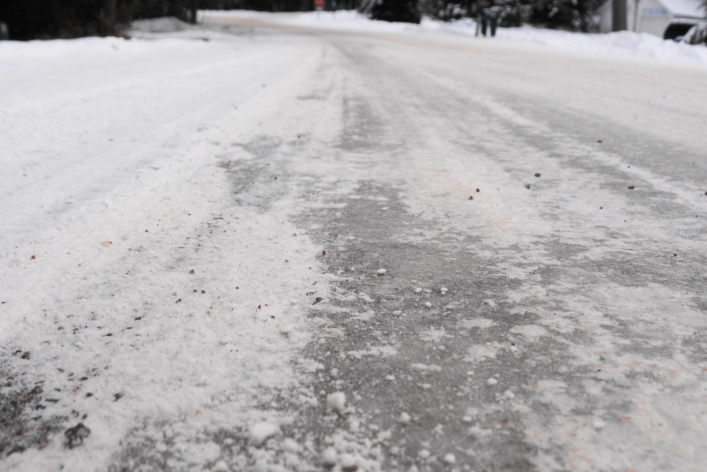 The ice that covers many of the roads is only about an inch deep.