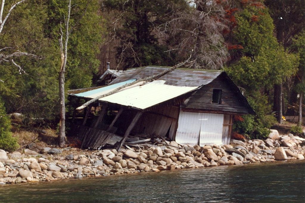 The old boat house on the north end has survived the snow and a branch bonking.