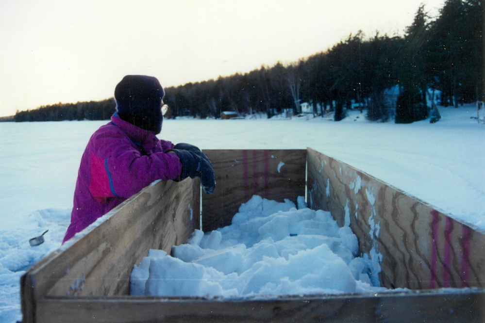 This is the first year we've used a formal fort building aid. The giant wall form is made from three 4x8 (1 inch thick) sheets of green treated plywood. One is cut in half to make the ends. The resulting wall is 8 feet long, 4 feet high, and 4 feet thick. That's a lot of snow. It took all of Friday to make the form and fill one wall.