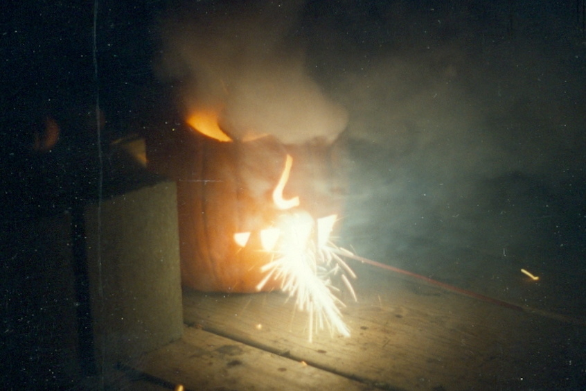 Some of us grew bored with the display and found some larger fireworks, crammed them into pumpkin holes, and lighted them. The results were horrific for the pumpkins and entertaining for us.