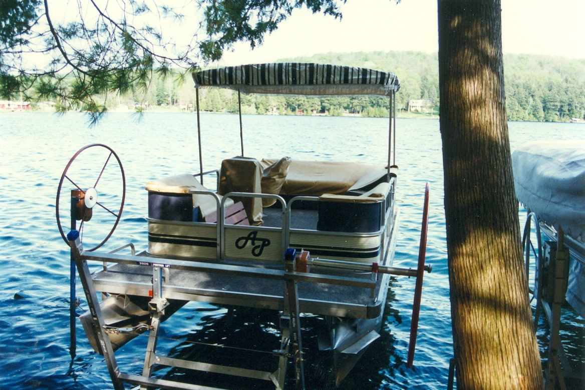 It turns out that the issue with starting the pontoon boat that vexed us last time up had to do with the fuel line...it needs to be connected to the engine to ensure a proper start. After connecting the line it fired right up.