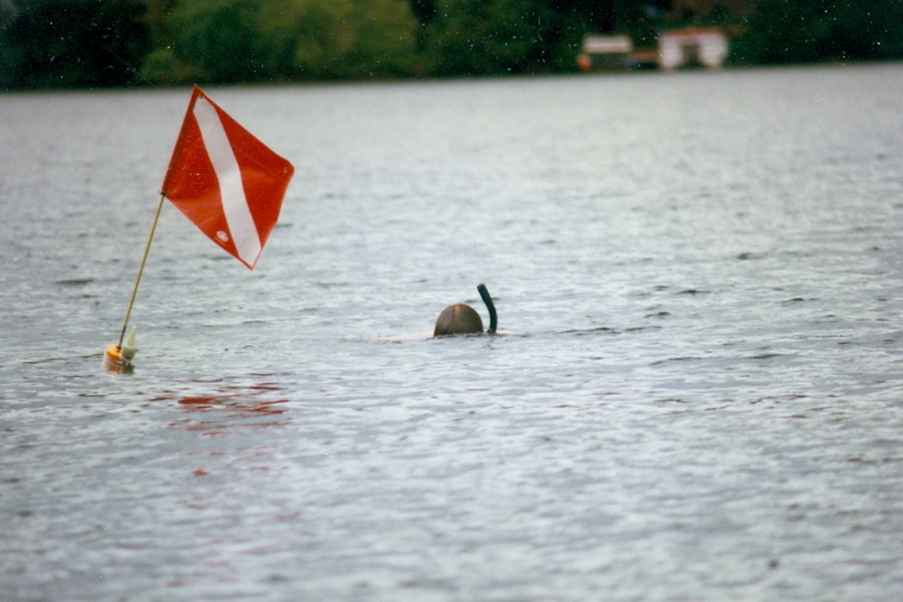 The lake water is at a barely swimable 62°F. I dove for many golf balls for almost 20 minutes, then shivered out.