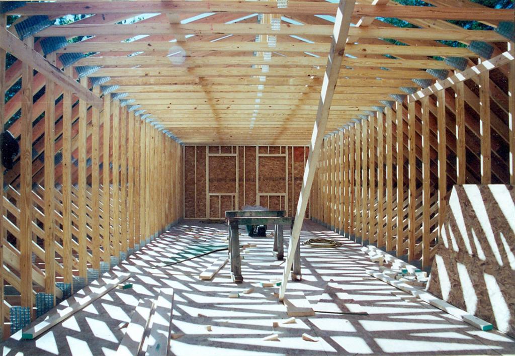 The new car hole has 2 saw horses and few new roof trusses.