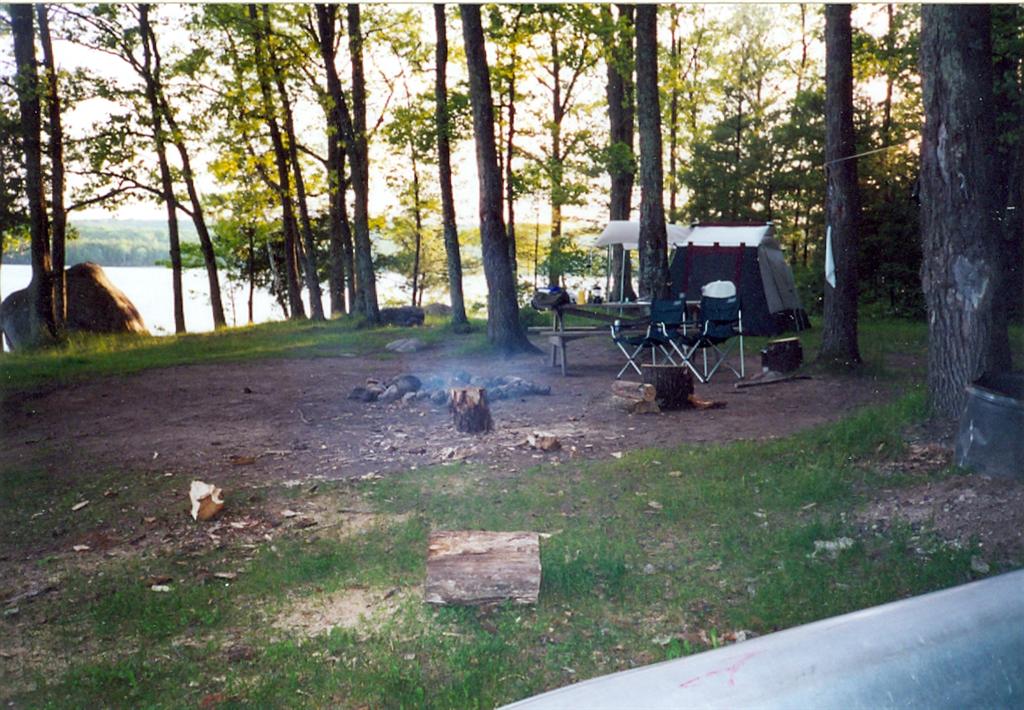 We got the good spot on the island on Wabikon! The big rock (left side of this image) is still there and it's best to bring your own firewood. The island has been pretty much picked clean of all downed burnables. At about 3:30 AM, a large herd of drunken teens almost invaded our camp, but ended up crashing on another site to the North.