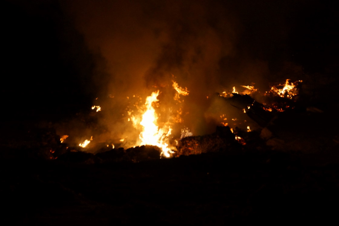 Are you famliar with the giant pile of pallets just to the northeast of the intersection of Hwy 8 and County W? The stack has been growing for several years now. Late last week (Friday) they became one of the biggest bonfires ever!