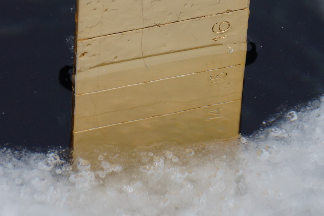 There's 5.5 inches of snow on top of 2 inches of slush on top of 13.5 inches of ice covering the lake.