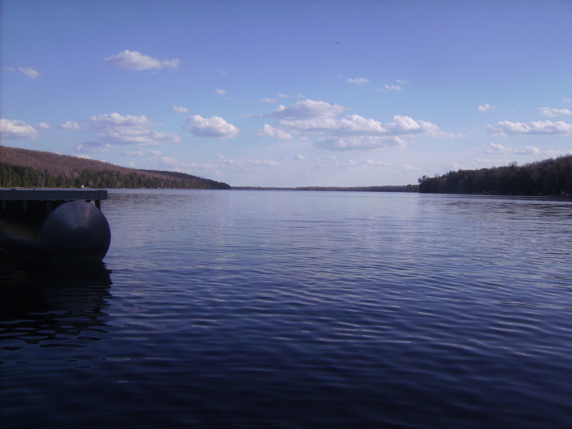 Faux Summer. It feels just like Summer with highs in the 70's°F and a liquid lake. It differs from Summer by its length. About 3 days in this case. You can pack a lot of stuff into 3 days. There was golf (10 Points), campfires (2 Points), paddle boating (10 points), and swimming (5 Points). Well, not really swimming (5 points), but going into the lake to put in piers and the paddle boat lift (cabin work, 10 points per half hour). The lake is cold. Really cold. We do not recommend any kind of swimming today. There are flags posted on some shores that warn of sharks or rip tides. There should be one flying on Lake Lucerne to signify the water is too cold in which to swim. I see the flag as a blue shivering guy on a white background with maybe some snowflakes.<br><br><br>-Nemo's babbling something about shrinkage.
