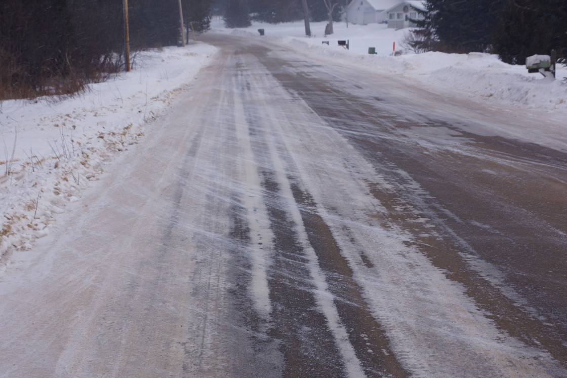 The wind streamed new snow over the landscape. It made the roads interesting.