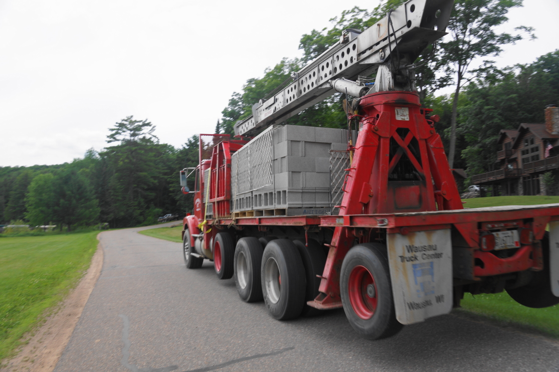 After a few days of drying out, trucks bearing block were spotted along West Shore Drive.