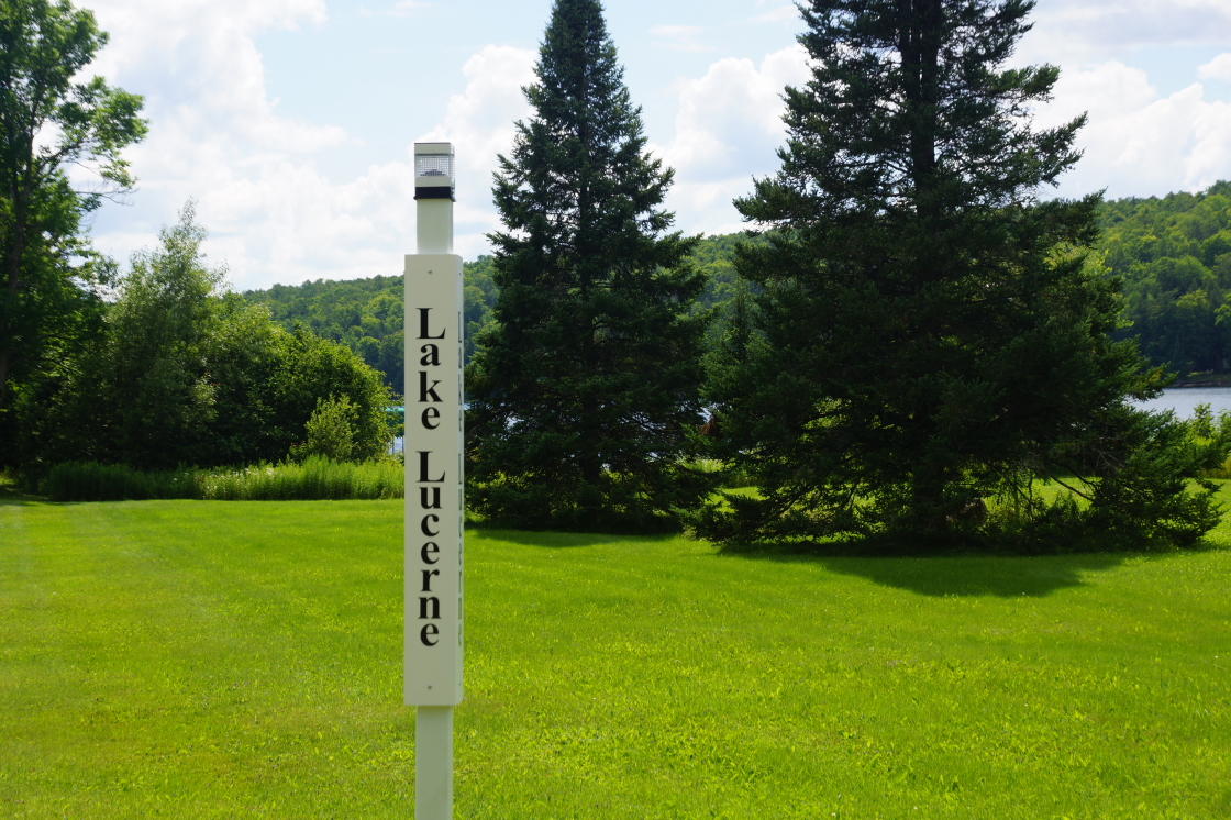 By the end of the week, the bar's lot line was prettied up. New Times Roman!