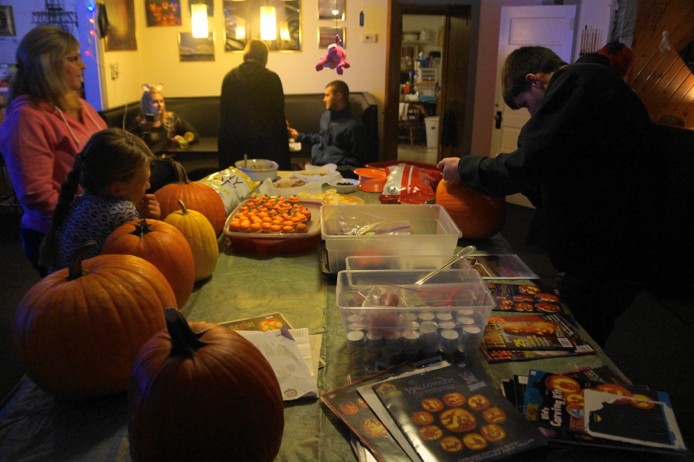 About a score of people came out and butchered orange gourds while being over served well garnished cocktails.