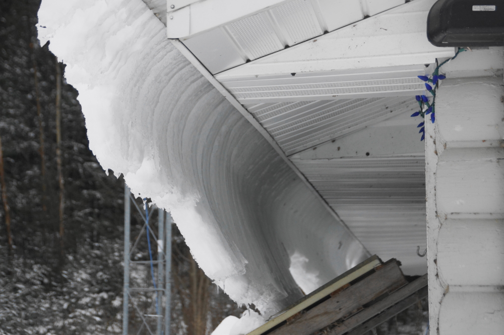 "Riding a Curl" is a bit of surfin' slang that, up here, means falling off a roof.
