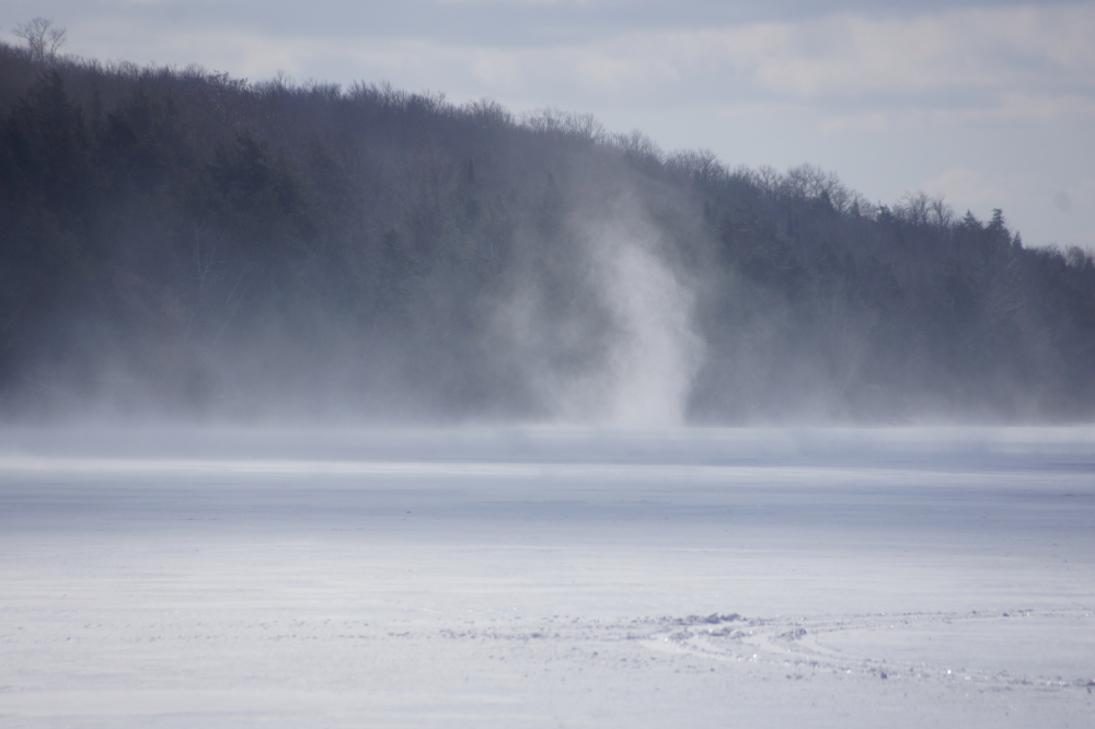 The wind picked up by week's end. Snow devils moved vast piles from one end of the lake to another.