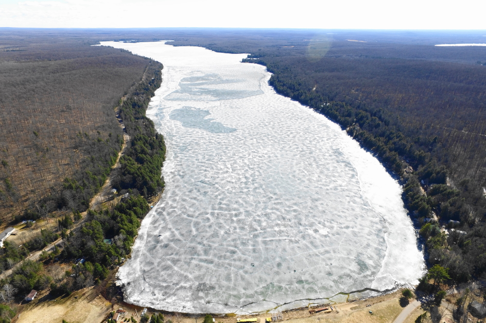 Lake Lucerne started last week white and cracking. Small chunks of lake ice near the shore broke off the main sheet and a bit of ski-able water peaked through the fissure. The gaps were small, but big enough to launch a model boat and have mice or squirrels to do a keyhole or two.
