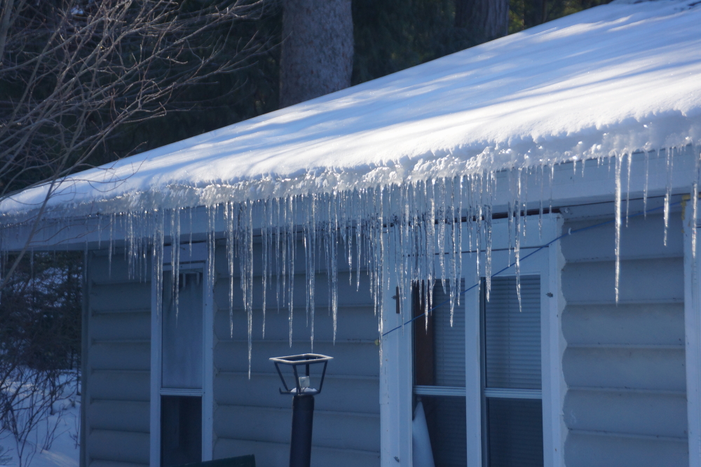 The ice coming off the bar's roof is over a yard long. 