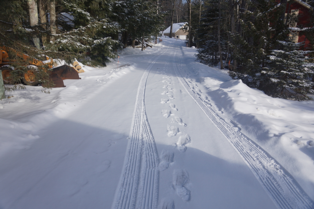 Under the snow on Knott Lane, there's a thick layer of ice. Running down the Lane is strongly discouraged. 