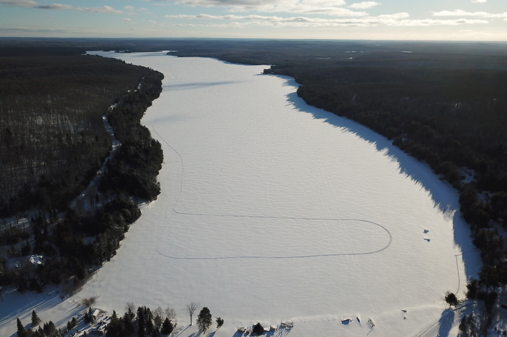 As soon as the sky cleared, snowmobilers painted the lake with the northern Wisconsin version of crop circles.