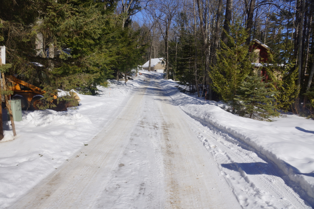 A few days last week went above freezing. Then the air dropped back down to well below frosty. This anti-thaw cycle turned Knott Lane into a treacherous sheet of ice with a delightful dusting of snow on top.