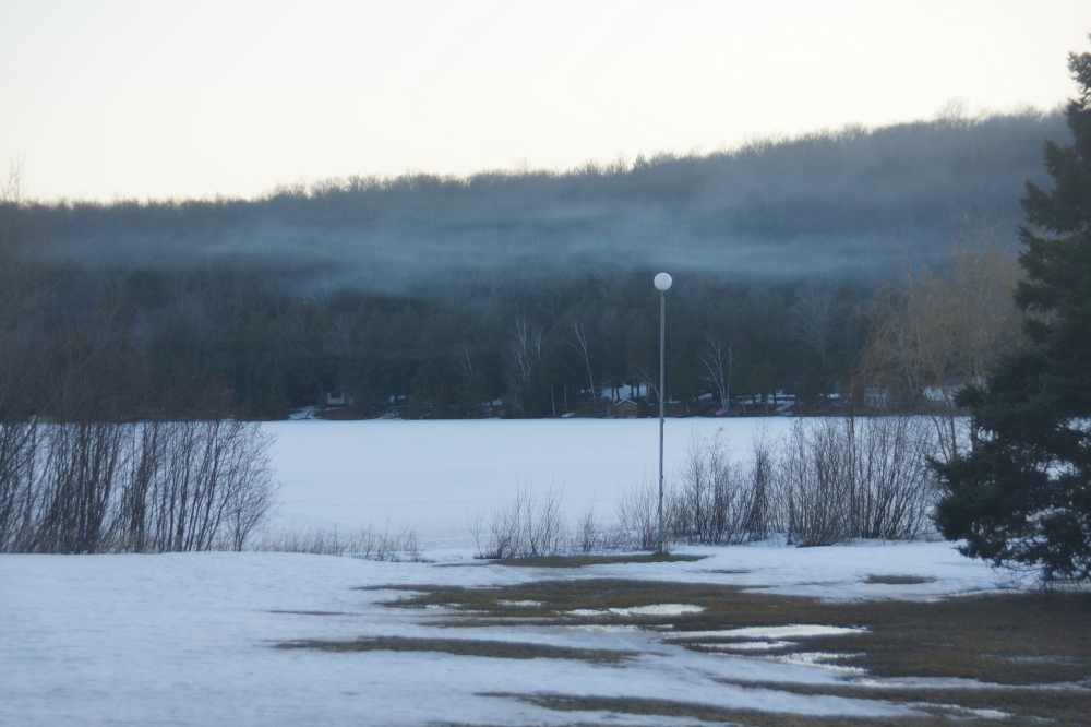 The smoke from the fires wafted over the lake in thin threads on calm nights and mornings.