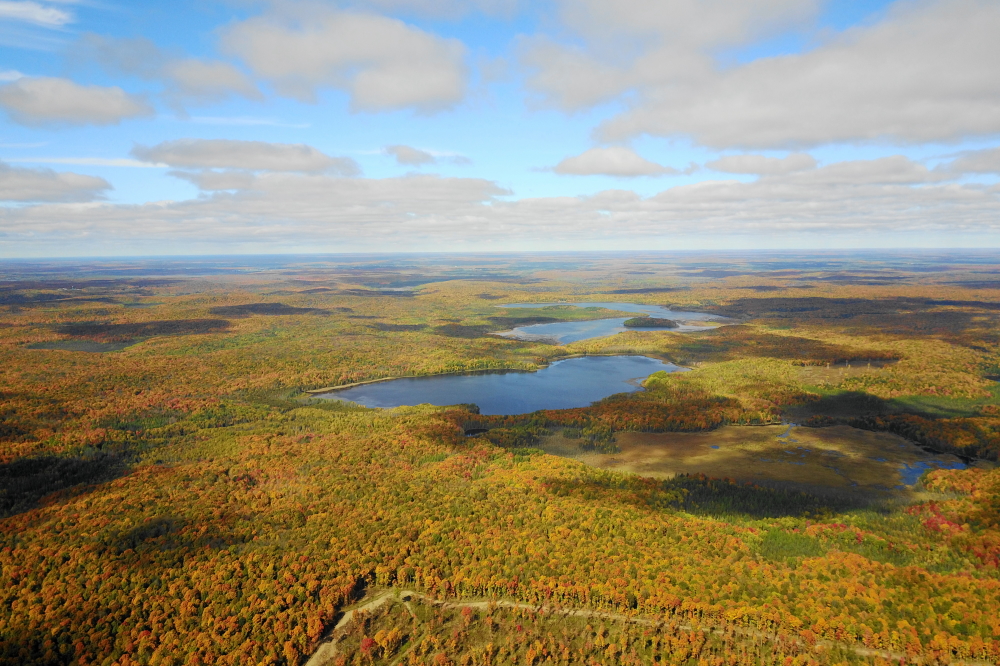 The hills around Lakes Riley and Wabikon seem to be holding on to their green a bit longer.