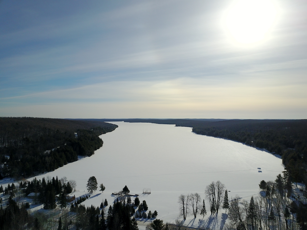 Before the weekend, the lake was white and flat, littered only with the corpses of fallen snow devils that were touched by neither track nor ski.