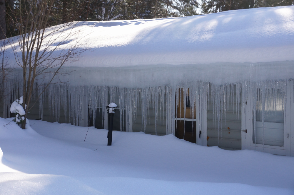 The bar's icicles reached the snow drifts . This gave the view out of the windows a real un-Summery feel.