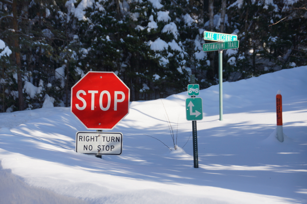 Before the snow storm, right turns continued to enjoy the freedom from stopping. After the blizzard, all you can make out is part of a mostly buried red octagon.