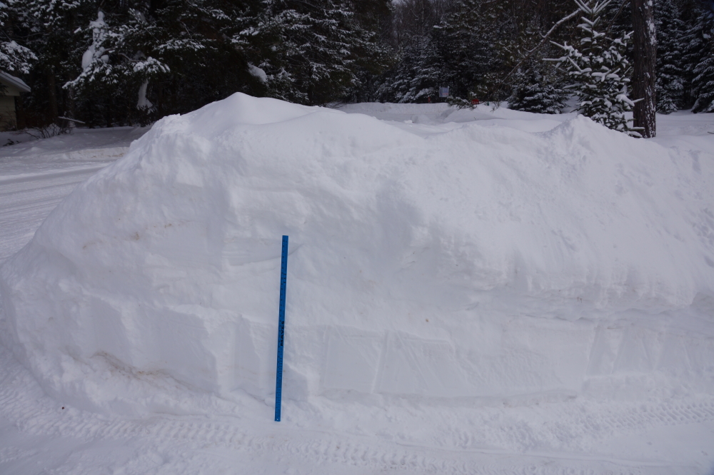 The piles at the end of driveways were substantially higher. On the weekend, a friend with a skidsteer widened our road entry and the piles went from close to 6 feet (seen here) to 10 feet.  It'd make a good sledding hill if it weren't so cliff-y.
