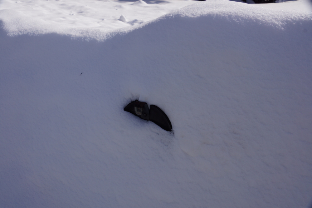 Lone mailboxes are easy prey to the mighty waves of snow.