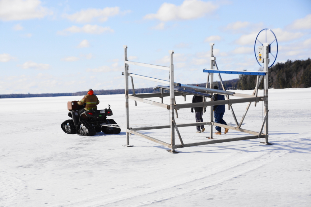 The ice was a little thick to put lifts in, but thick enough to move them around the lake.