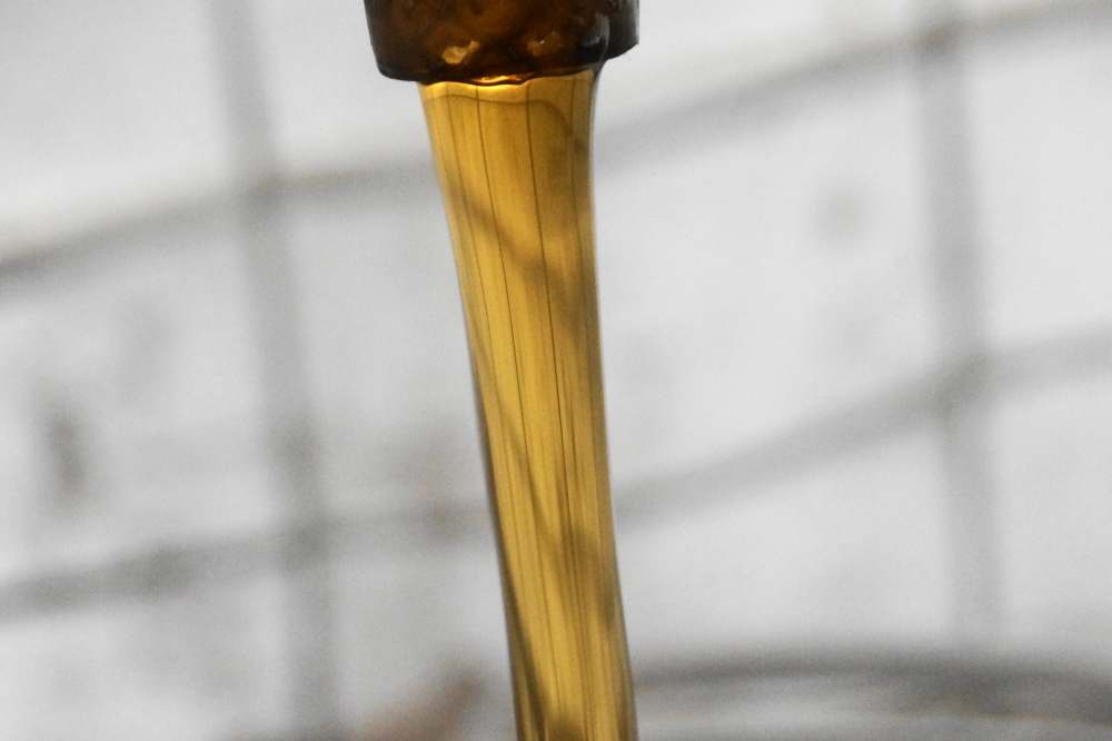 After cooking, the sweet results were filtered and bottled. 