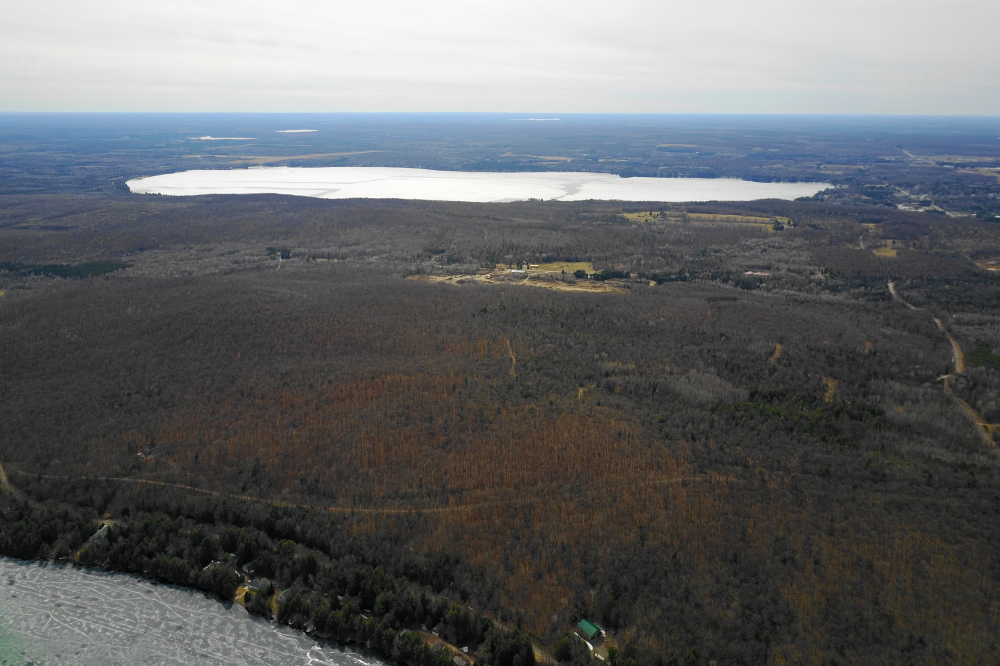 Lake Metonga still has ice, but it seems to be breaking into great sheets. One or two days of strong wind and warm should sweep it clean.