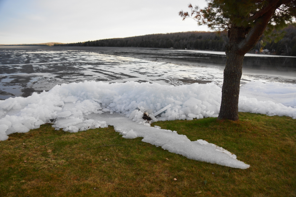 Late Thursday, the sheet unlocked from the shore and began to push up on parts of the North end of the lake. The fingers of cold reached out almost 30 feet onto lawns. That, and a very squishy ground made any mowing impossible.