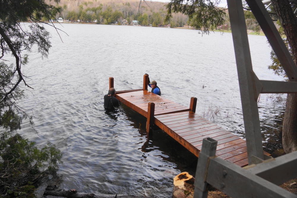 A few piers went in. The water is at 45°F.  That's well below the "very refreshing" range and into the "stop screaming, you're scaring the bears" range. The sections went in without incident. Afterwards, blankets and throat lozenges were enjoyed by all.