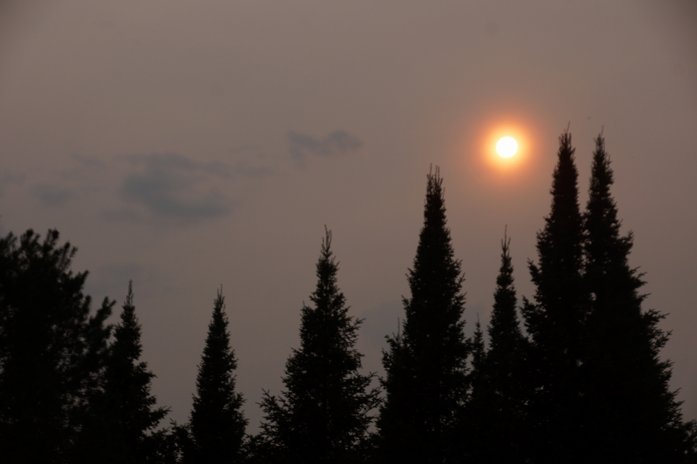 The sunset on Thursday was strange due to a high haze from wild fires in Alberta.