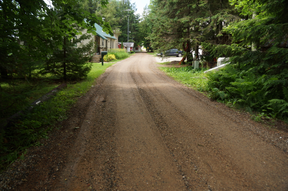 By mid-week, the ponds and puddles had streamed away and Knott Lane got a new, smoother surface. Now motorists can enjoy cruising down the lane at the posted speed limit (12 mph) without fear of blowouts or suspension damage. 