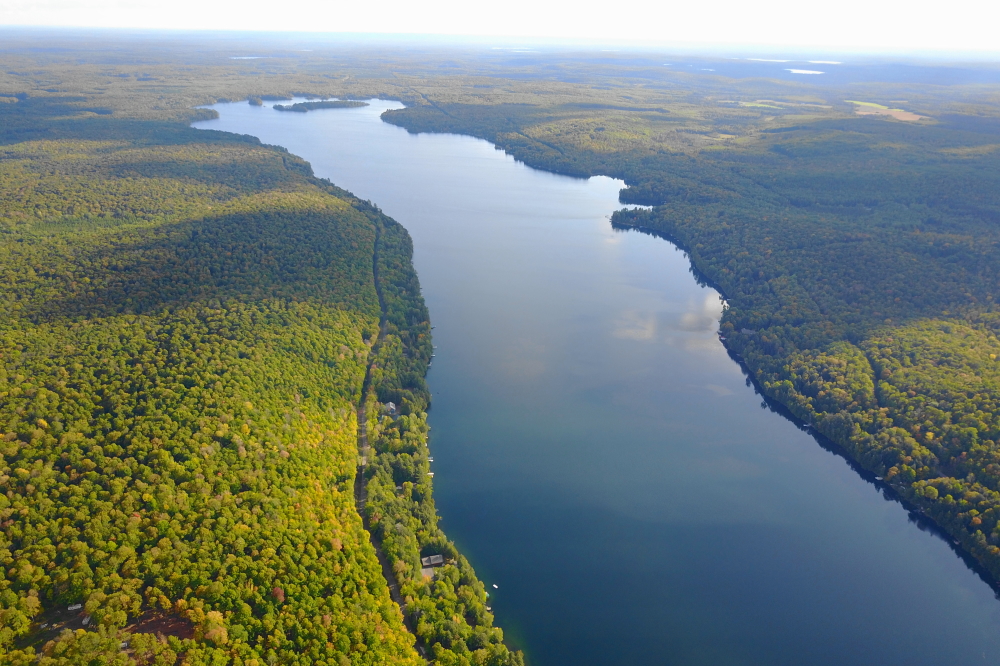 It was warmer last week. Not the warm you would normally see in July, but the coolish warm that mostly succeeds in banishing the chill from the days just after Labor Day. There was some sun, a very flat lake, and a bit of Autumnal color, too.