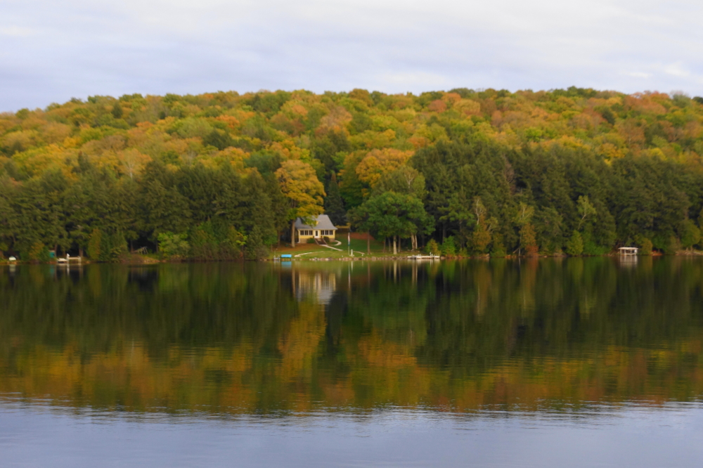 In a normal year, we would expect the colors to peak by the end of last week, but there's still a touch of green in the canopy around Lake Lucerne. It's close though. Peak color's just a frost away.