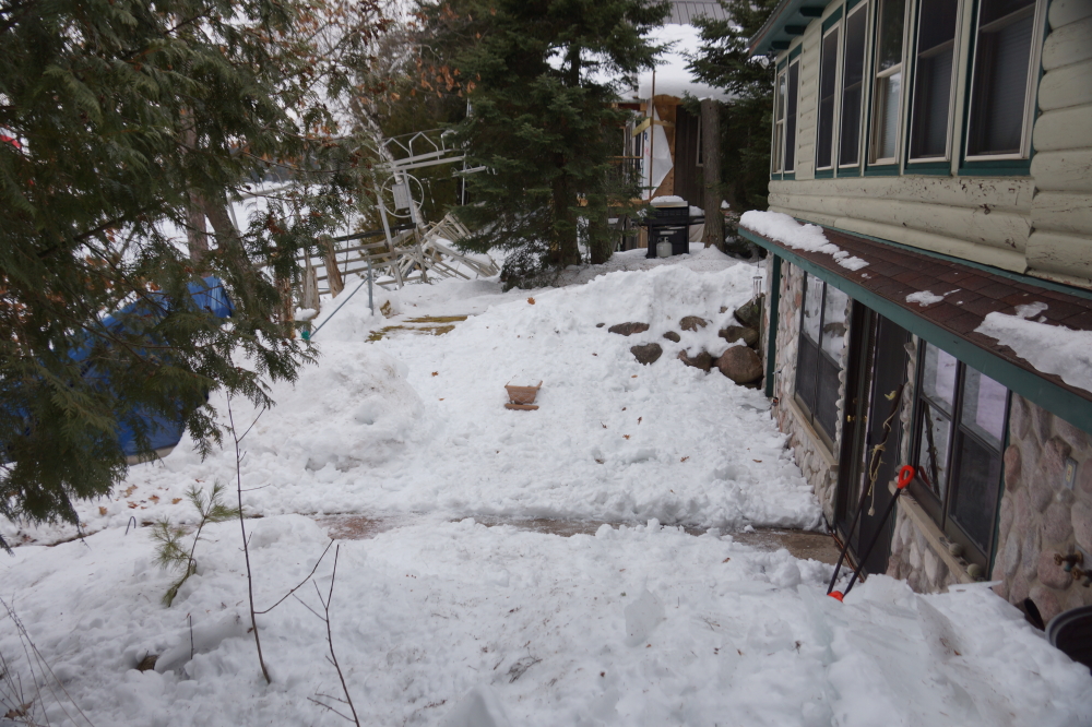 Near the end of the week, the remains of the 2 feet of snow that burdened metal roofs lost their grip and came crashing down. Great sheets of ice, snow and slush blessed previously clear decks and walkways. Those fortunate enough to have this event occur in the early evening had the added bonus of having the mass freeze and bond to the concrete overnight. 