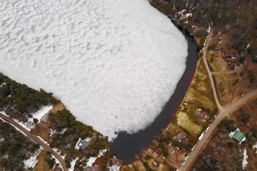 Most of the hail melted in less than a day. The ice sheet started to pull from the North shore of the lake a bit more than the previously.