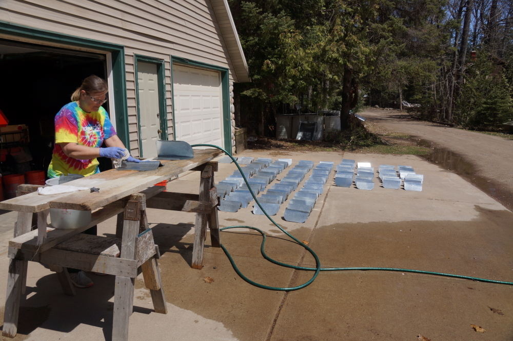 The sun  and warm eventually returned and some used the weather to finish up the dishes from sapping.