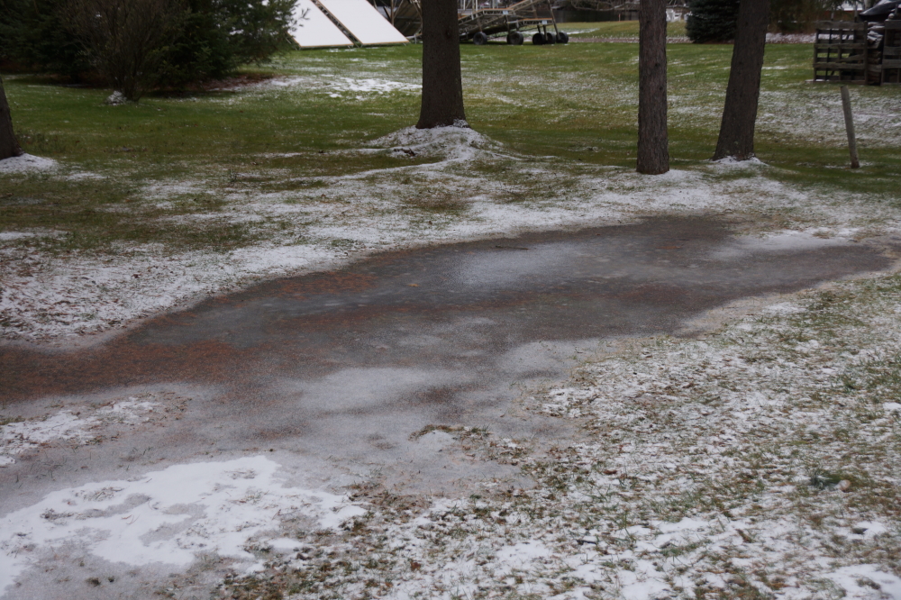 Some of the snow melted by the weekend, exposing many frozen lawn puddles.