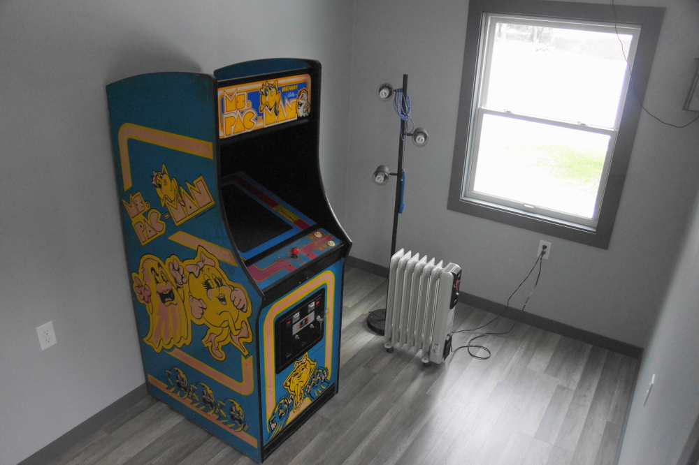 The wonderful weather made it a good time to begin loading coin-ops into the bar's new video pit. The howling of the wind in the hemlocks and the calls of the loons will soon be augmented by the pitter-patter of tiny 16 bit feet.