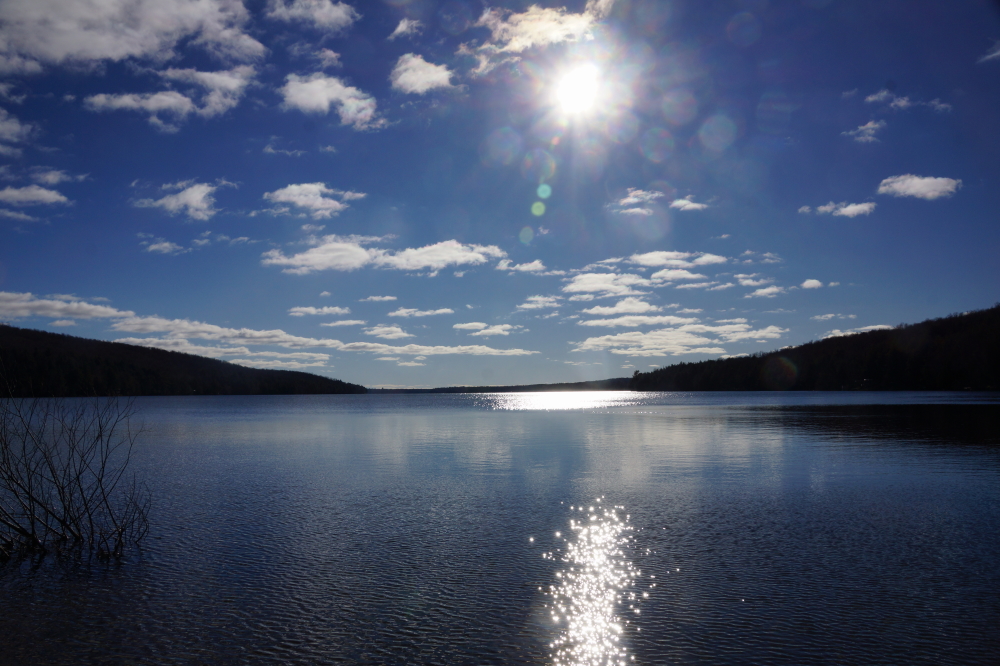 The trees have long lost their leaves and the frost in the ground goes about 6 inches deep, but the lake spent much of last week looking like it did back in May. The water was cold, but open. Much of that Mayness ended late in the weekend. 