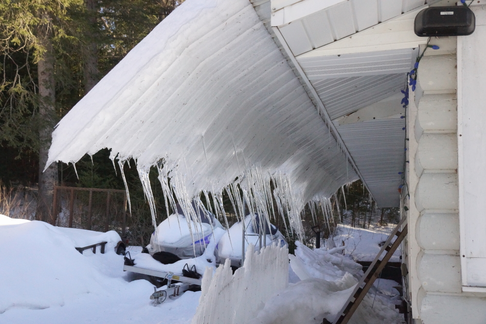The storm created ice sheets that covered the bar's roof. When they started to slide off, it got cold. The frozen extendo roof is one of those transitory architectural features on many dwellings this time of year. 